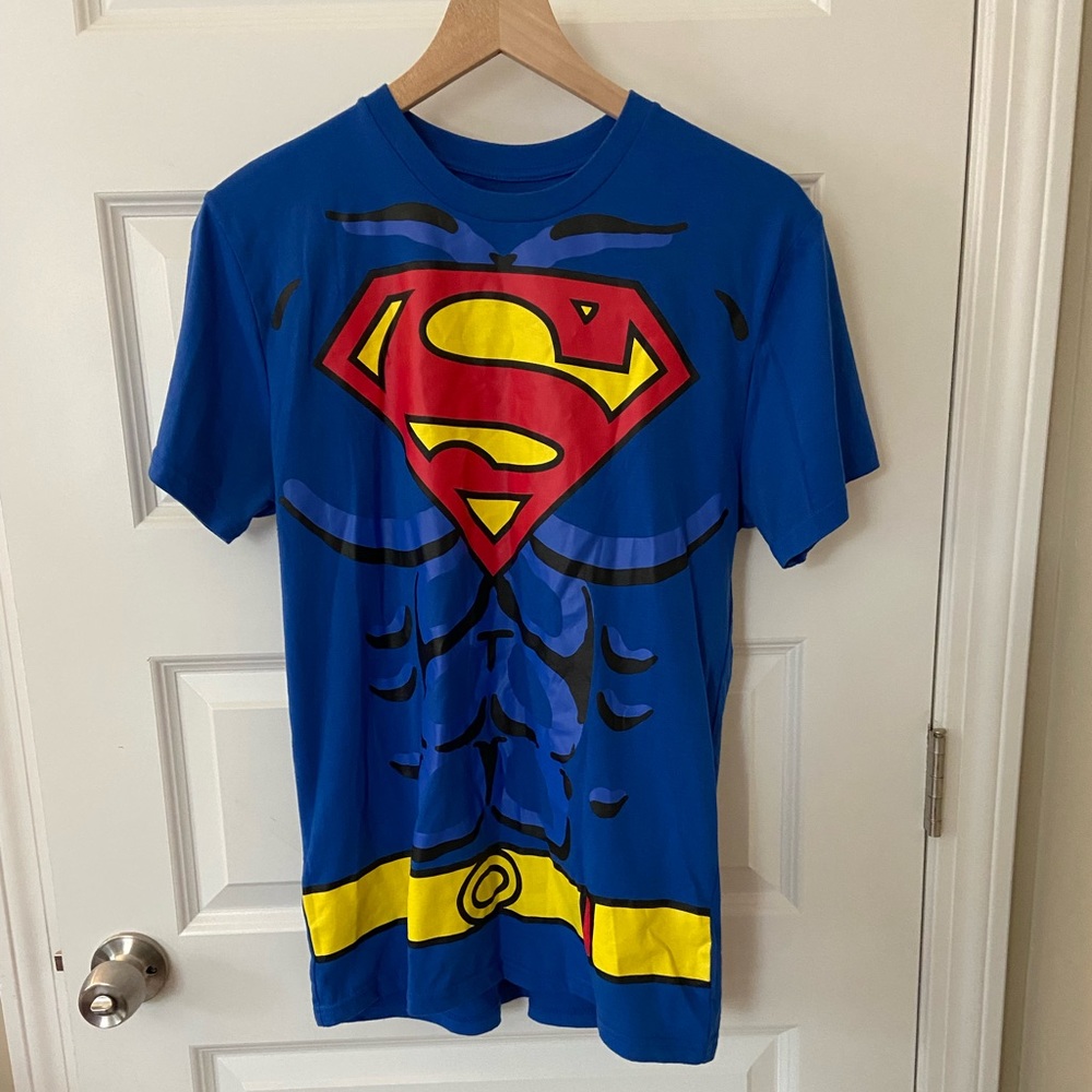 Superman T-shirt with cape, boot covers and arm covers.  Worn twice.